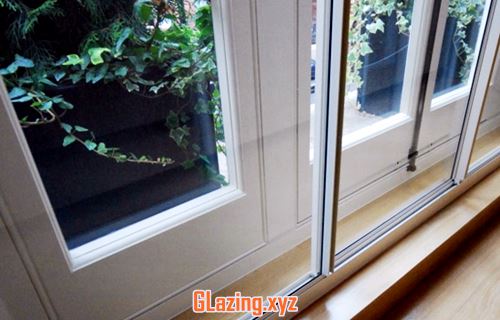 Wood effect triple glazed windows
 After Replacement